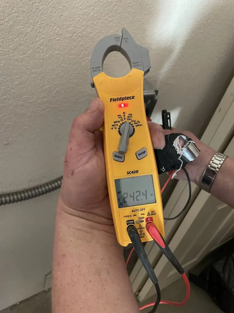 Voltage testing with clamp meter during Recessed Lighting Installation in Eugene
